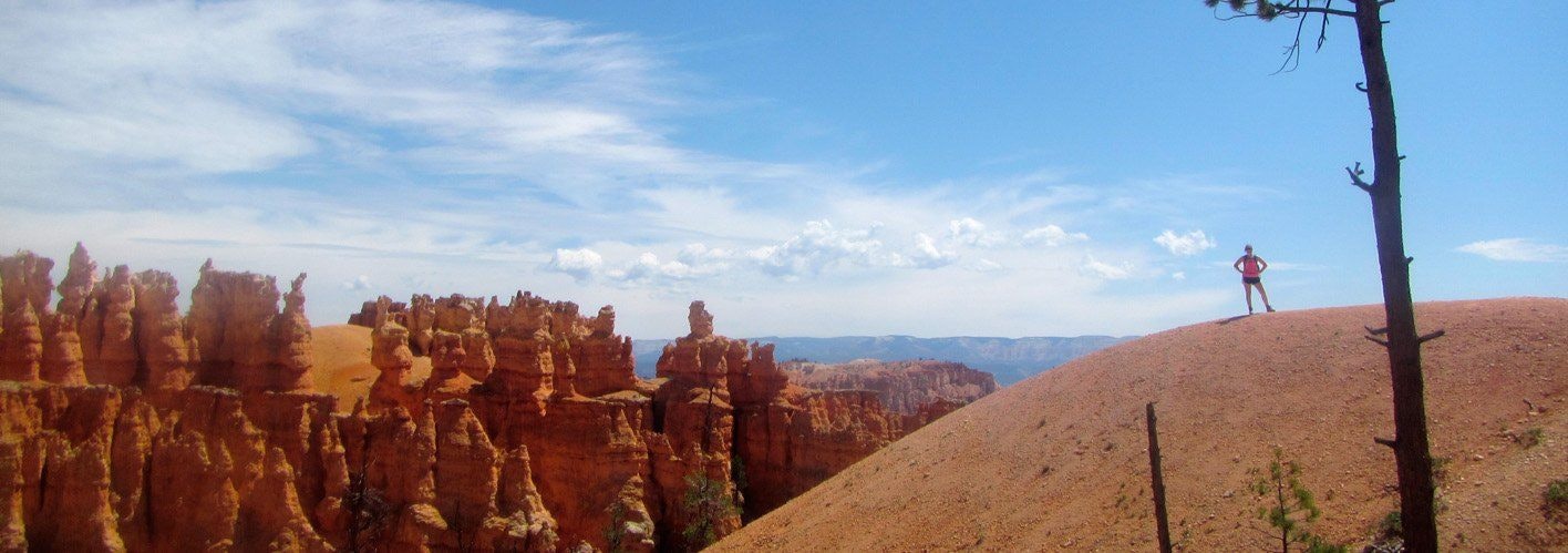 Element Three's Amy Burklow's Hiking Adventure with a blue sky over a tan mountain range
