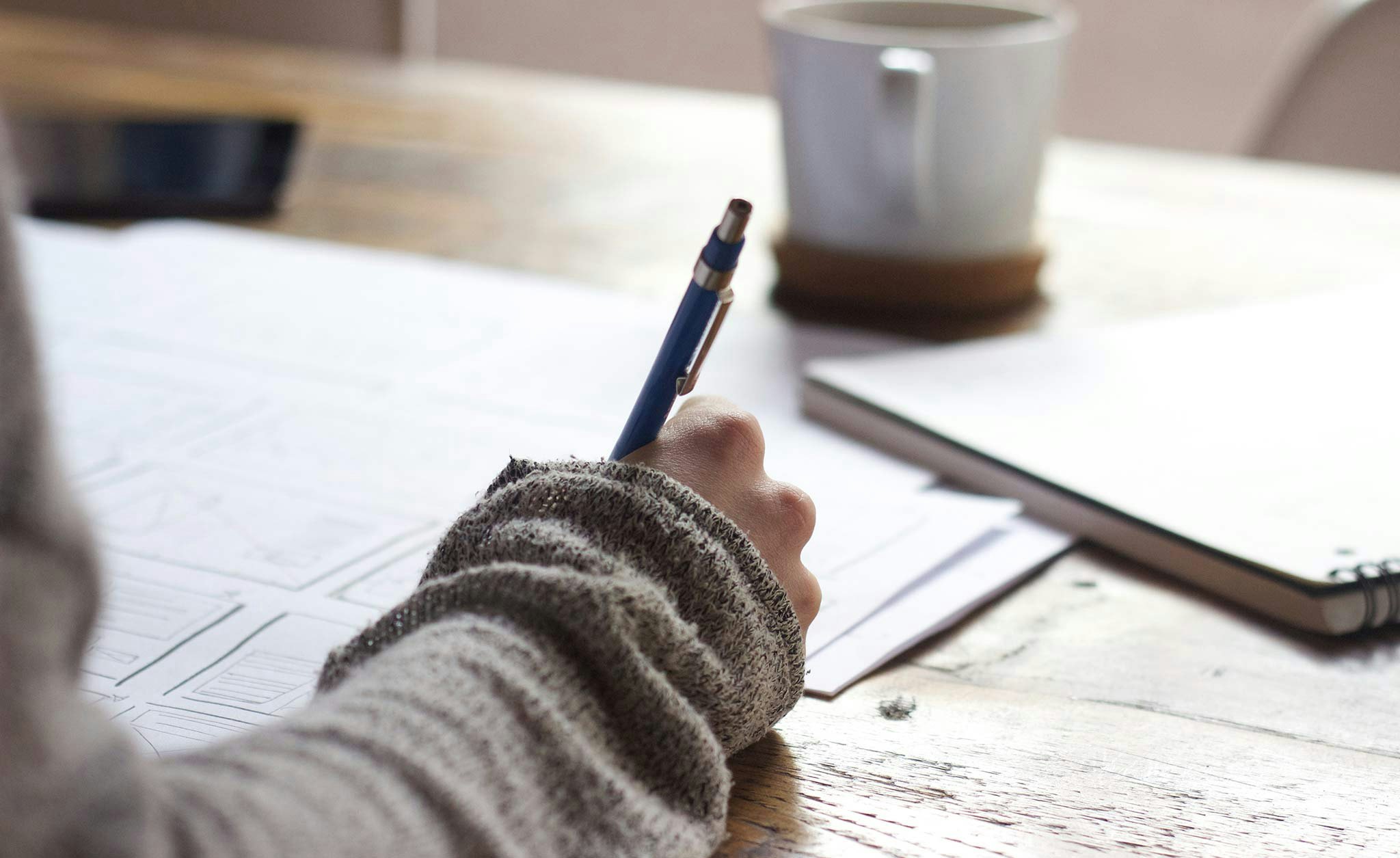 Person Writing a Brand Plan